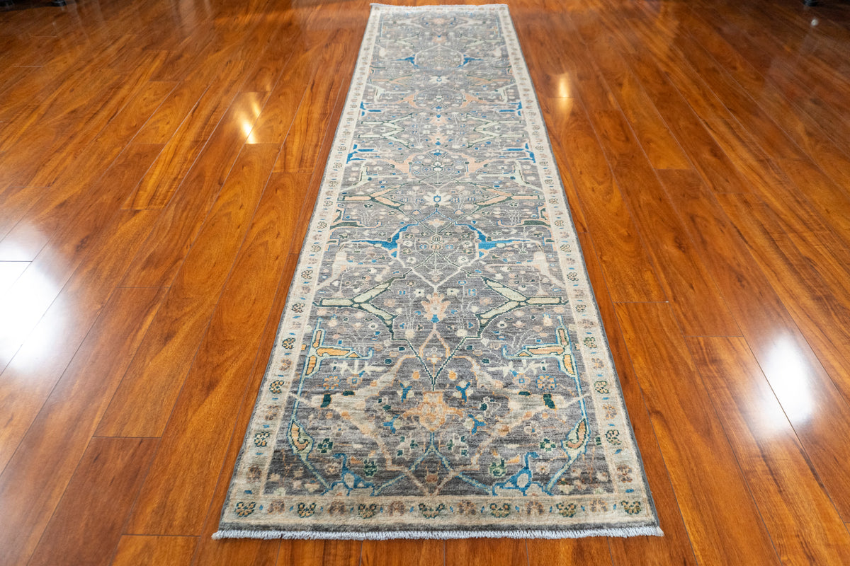 Farahan Afghan runner on a wood floor, view from the end showing the full length
